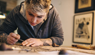 Erica Lang working passionately in her studio.
