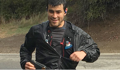 Kristpher Mendoza out on a run on the road and happy doing so come rain or shine.