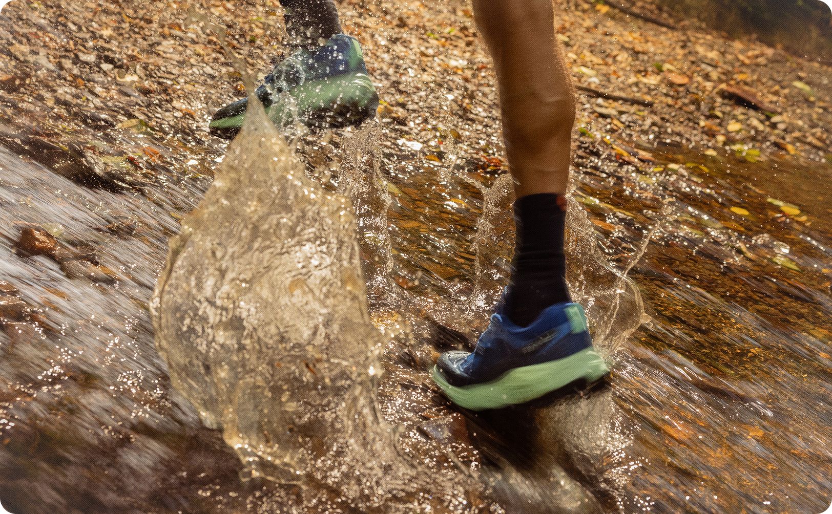 Person running through a puddle