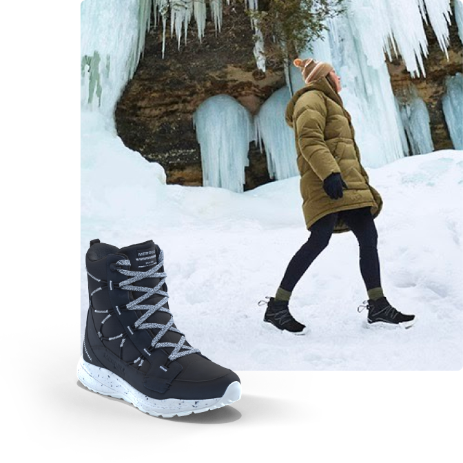 Walking beside a frozen waterfall with boots on.