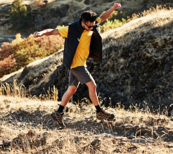 Man hiking in some hills.