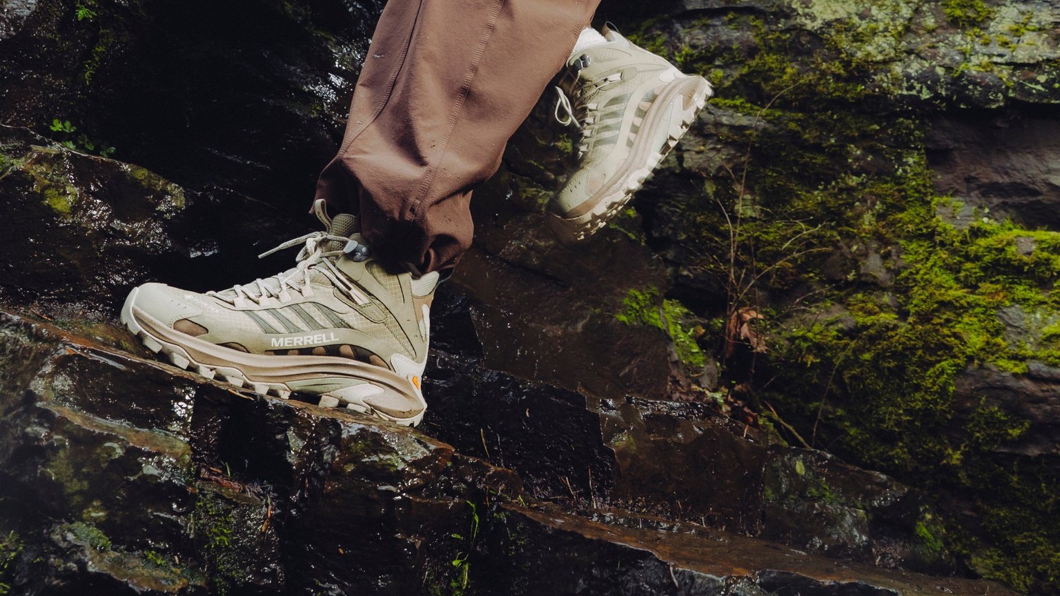 Merrell hiking shoe gripping wet, mossy rock