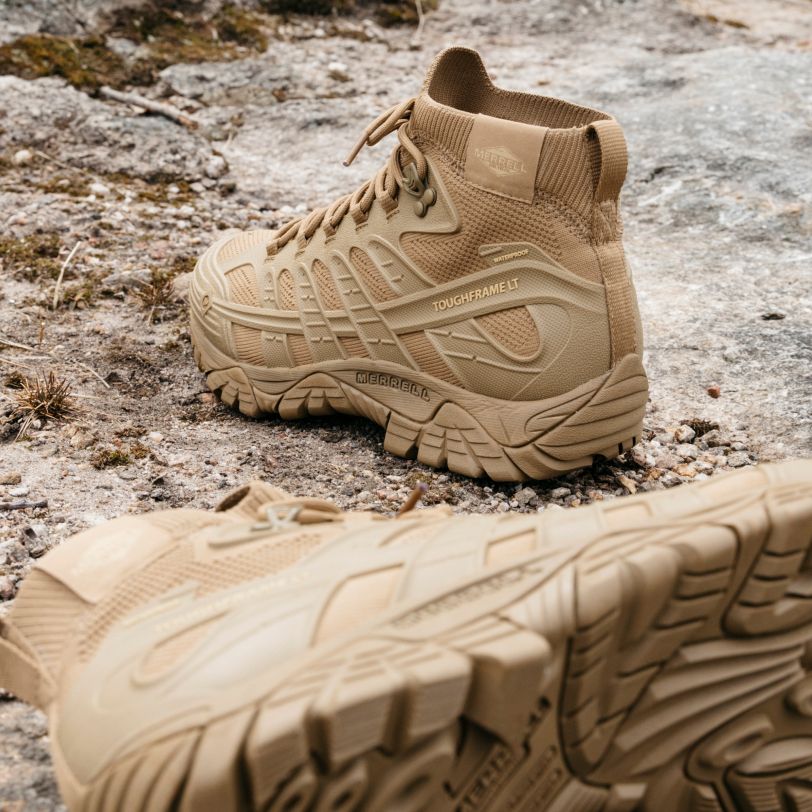 a pair of tan hiking boots