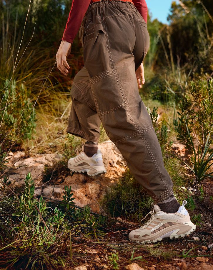 Man in woods wearing Merrell hiking boots