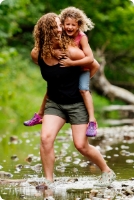 Mother and daughter playing in the water.