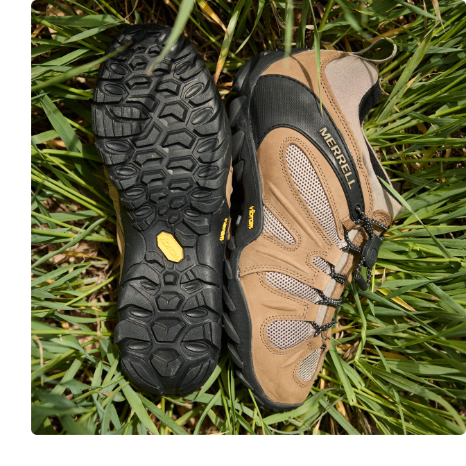 Person running a hiking trail in a pair of Chameleon 8's.