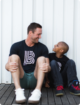 Man and boy hanging out and smiling