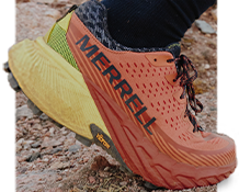 Agility Peak 5 running shoes in blue, red, and white.