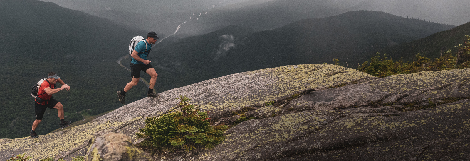 Man wearing Merrell MQM shoes while hiking in the mountains