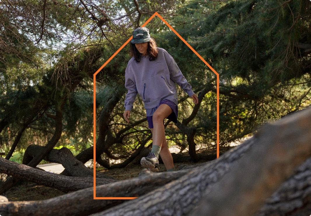 Person hiking in Merrell gear.
