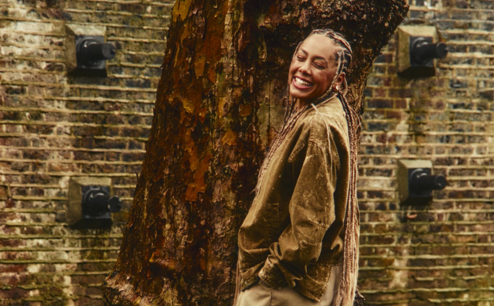Jayda G in a an outdoor setting smiling .