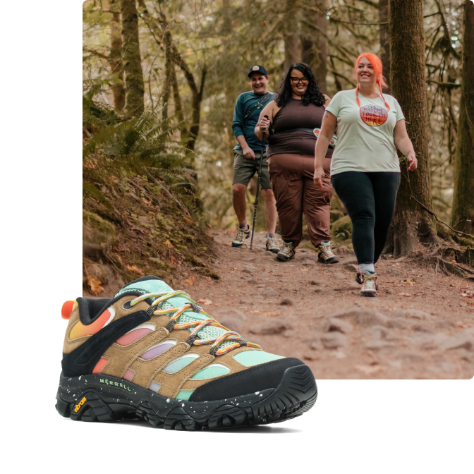 Three people hiking while wearing Merrell's