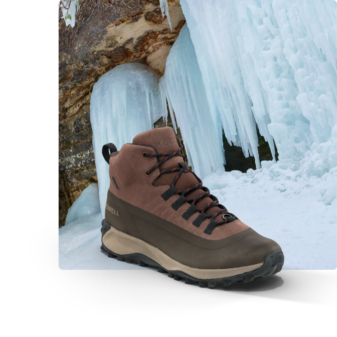 Shoe beside a frozen waterfall.