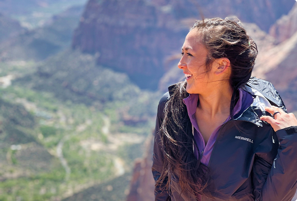 Christina standing outside wearing winter Merrell gear.