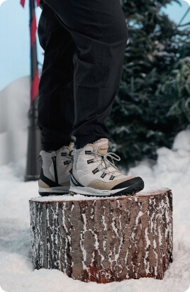 Winter boots on stump.