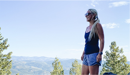 Brooke Froelich bravely holding her infant just feet away from the edge of a 200 foot canyon wall.