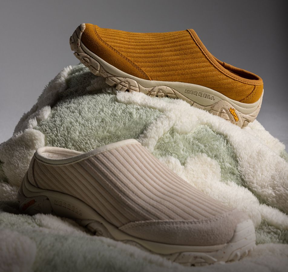 Person tying Merrell running shoes