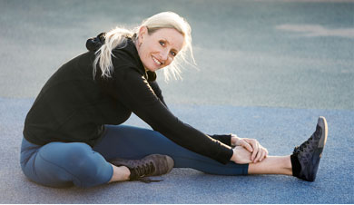Julie Angel staying limber while stretching out her hamstrings from her last great outing.