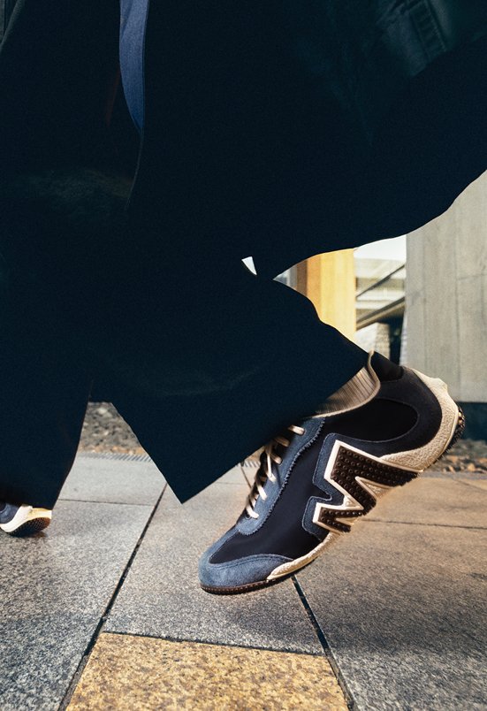 Merrell everyday sneakers worn on a city sidewalk.