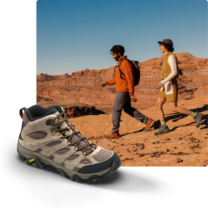 Person running a hiking trail in a pair of Moab 3 mid's.