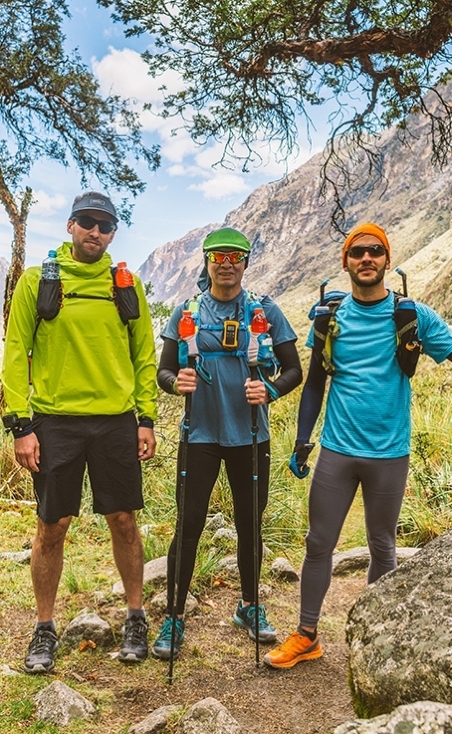 Runners posing in the mountains after a run