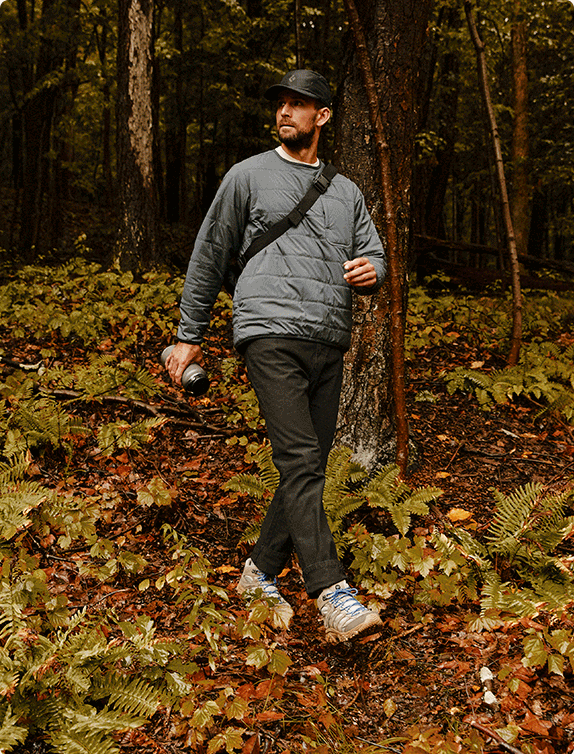 Gif of person walking ouside in the woods in fall, wearin the new Moab 3 Huckberry edition.