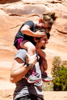 Little kid on parent's shoulders.