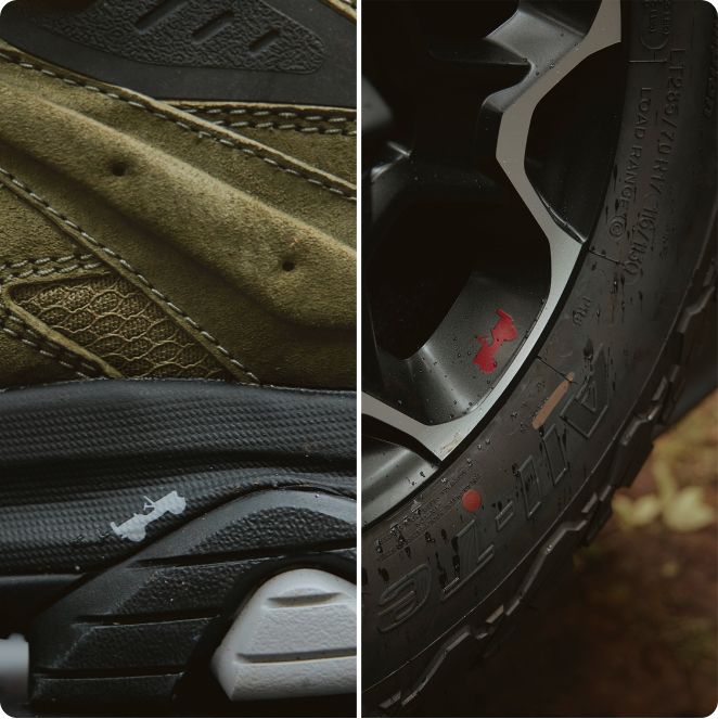 Close-up of a Merrell shoe and Jeep tire, showing the support of both.