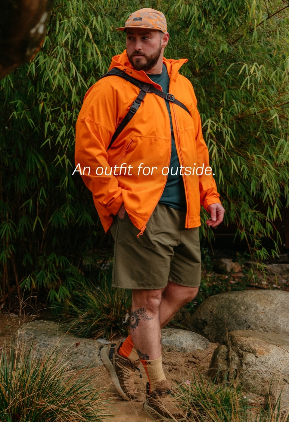 Person hiking in the whisper rain jacket.