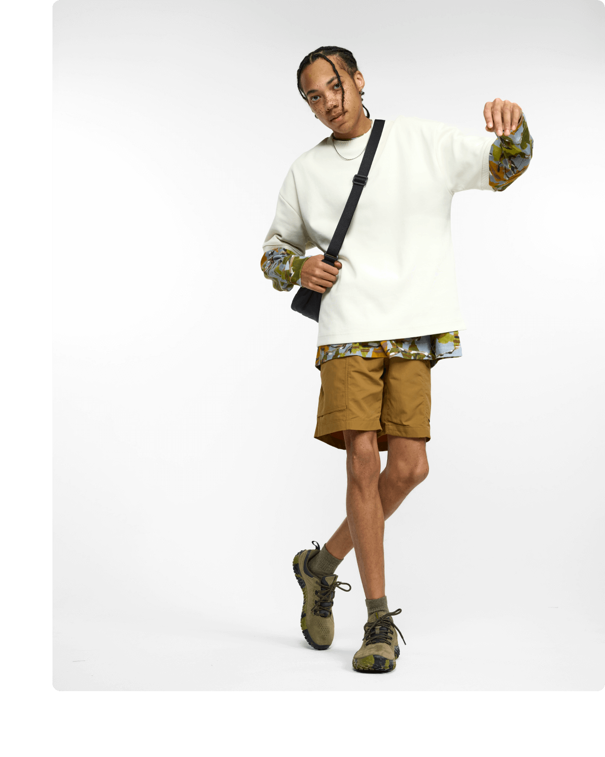 A person wearing men's Merrell wrapt shoes.