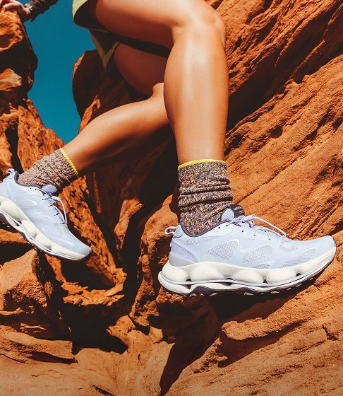 Woman outdoors in Merrell shoes.