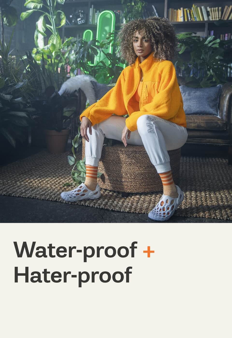 Person looking cool, sitting next to some plants, wearing hydro mocs and not caring about haters.