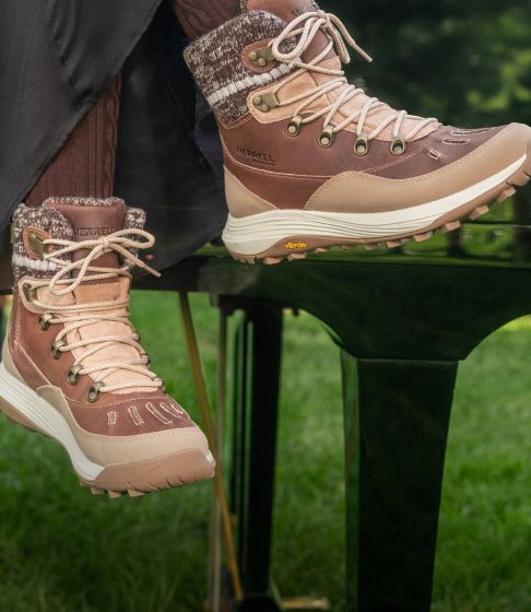 Woman outdoors in the snow wearing Merrell boots