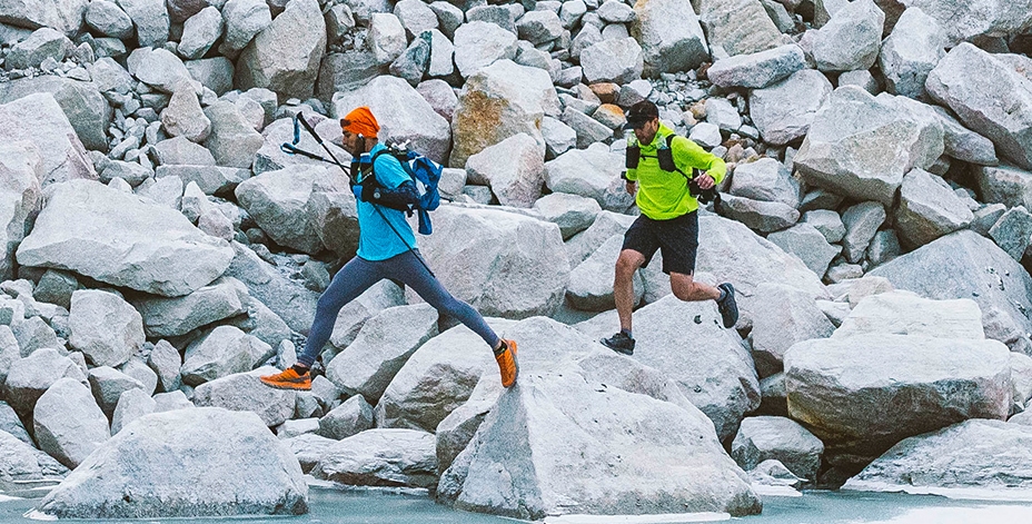 2 Men running on rocks